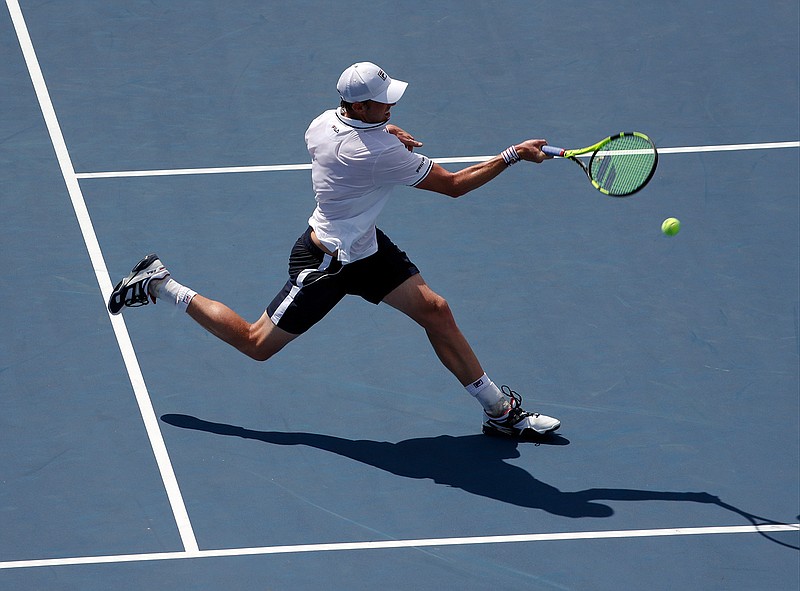 Sam Querrey, of the United States, returns a shot to Janko Tipsarevic, of Serbia, during the first round of the U.S. Open tennis tournament, Tuesday, Aug. 30, 2016, in New York.