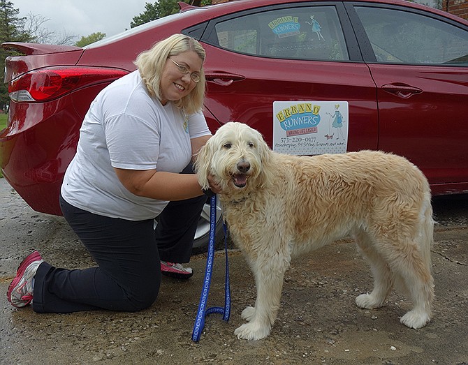 Client Mia and Amy Wayant, manager of ErrandRunners, prepare for a walk Wednesday.