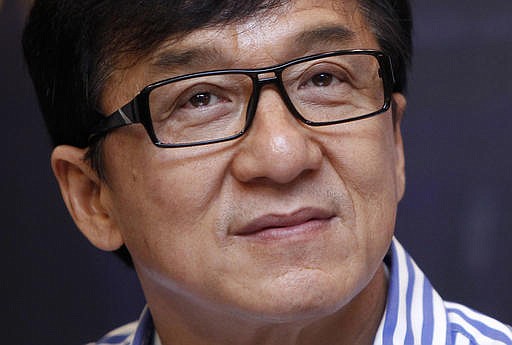  In this Dec. 18, 2013, file photo, Hong Kong actor Jackie Chan listens to a question during a news conference in Kuala Lumpur, Malaysia.