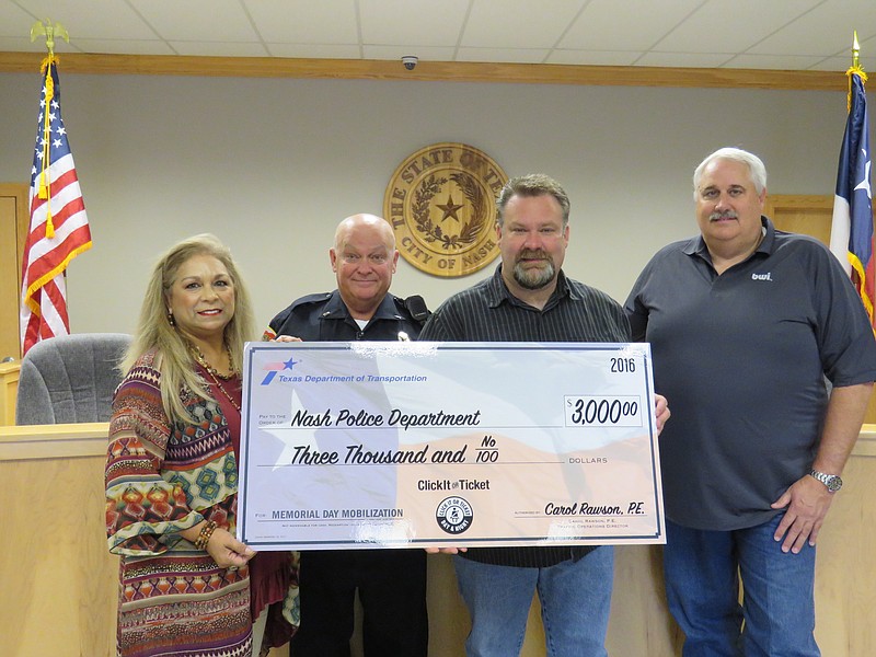 Submitted photo
Texas Department of Transportation officials present a $3,000 check to Nash Police Department on Friday, Sept. 2, 2016, as an incentive award for participation in this year's Memorial Day Click It or Ticket campaign. Pictured, from left, are TxDOT Traffic Safety Specialist Irene Webster, Nash Police Lt. Keith Copeland, Nash City Administrator Doug Bowers and Nash Mayor Robert Bunch.