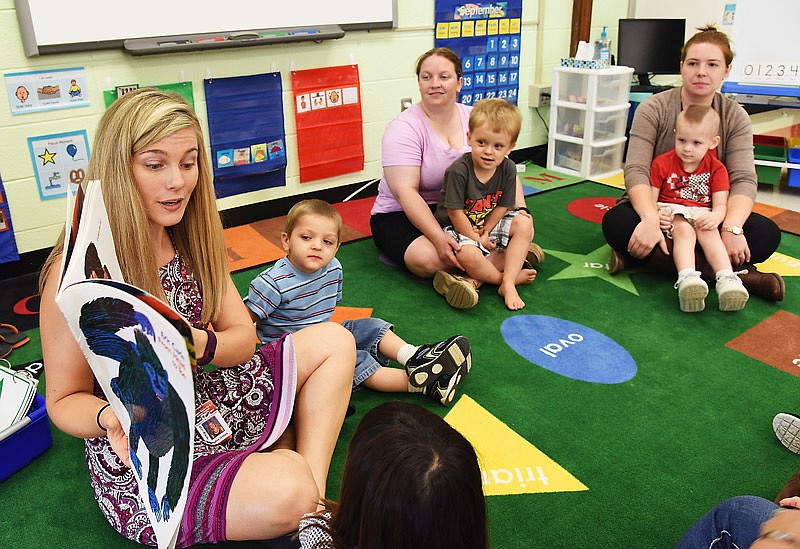 In this photo published Sept. 4, 2016, students and para-professionals in Safire Ortbals' (left) early childhood special education class at Southern Boone R-1 school listen as Ortbals reads from the book "From Head to Toe."