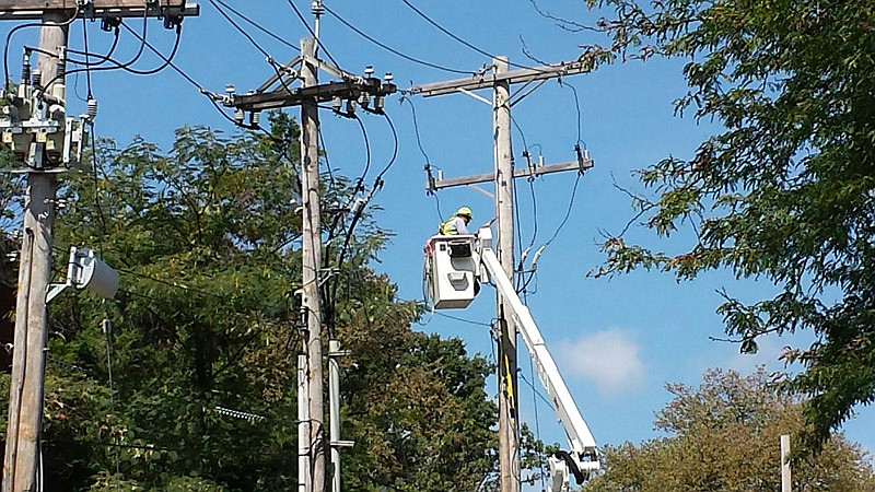 An Ameren Missouri worker does repairs in the area of State Street and Jackson Street where a transformer went out, leaving residents of Dulle Hamilton Towers without power for most of Labor Day, Sept. 5, 2016. 