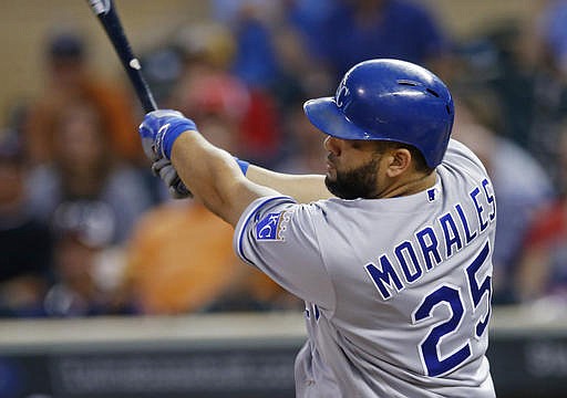 Kansas City Royals' Kendrys Morales follows through on a two-run home run off Minnesota Twins pitcher Ervin Santana during the first inning of a baseball game Tuesday, Sept. 6, 2016, in Minneapolis. 