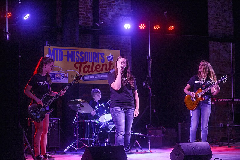 In this Sept. 1, 2015 News Tribune file photo, local band OCD, comprised of: from left, Lizzie Cremer, bass guitar, Scott Cremer, drums, Maddie Arnold, lead vocals, and Kelsey Bartlett, guitar; performs on stage at the Millbottom during the finale of the United Way's Mid-Missouri's Got Talent contest. 