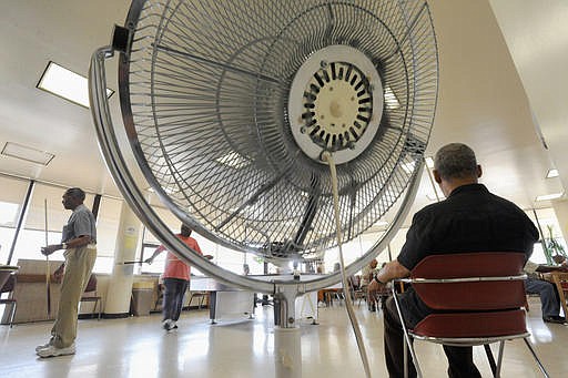 In this Thursday, June 9, 2011 file photo, seniors spend time near a fan at the Waxter Senior Center in Baltimore. The center was designated as a cooling station by Baltimore officials. Results of a study published Tuesday, Sept. 6, 2016 in the Journal of the American Medical Association suggest that in triple-digit heat, age-related changes that limit sweating might make fans less effective in those 60 and up than in young people. But the conclusion isn't clear-cut and the study authors say more research is needed.