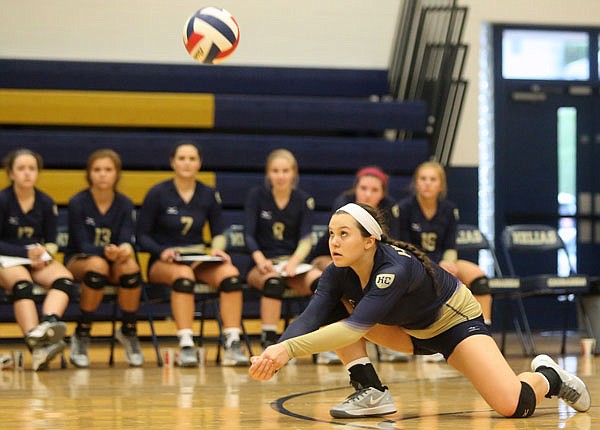 Regan Bruns of Helias gets a dig during a game against Nixa on Thursday, Sept. 8, 2016 at Rackers Fieldhouse in Jefferson City.