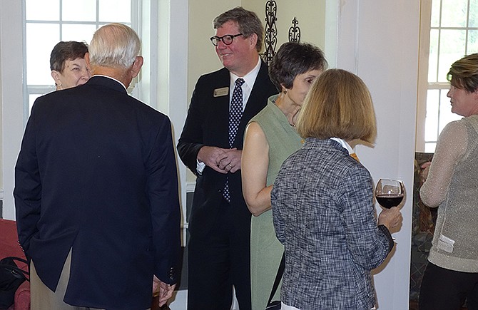 Tim Riley, director and chief curator at the National Churchill Museum, talks with people Thursday at an event at the Fulton County Club.