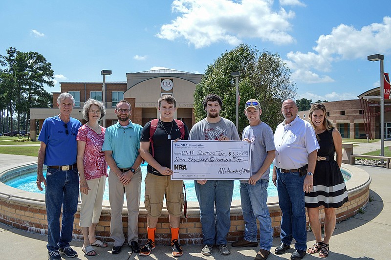 Pictured left to right: Cyril Stewart, vice-chairman of the Piney Woods Friends of the National Rifle Association Chapter No. AR28; Phyllis Stewart; Casey Curtis, UA Hope-Texarkana communications coordinator; Mason Henley, UAHT shooting team member; Nicholas Storar, UAHT shooting team member; McCall Groves, UAHT shooting team member; Haskell Morse, Hempstead County Judge; Jill Bobo, UAHT foundation director. Not pictured: Chris Townsend, UA Hope-Texarkana shooting team coach.