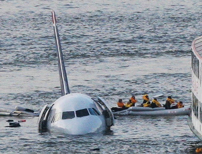 Passengers in an inflatable raft move away from an Airbus 320 US Airways aircraft in January 2009 that went down in the Hudson River in New York. More than seven years after an airline captain saved 155 lives by ditching his crippled airliner in the Hudson River, now the basis of a new movie, most of the safety recommendations stemming from the accident have yet to be followed. 