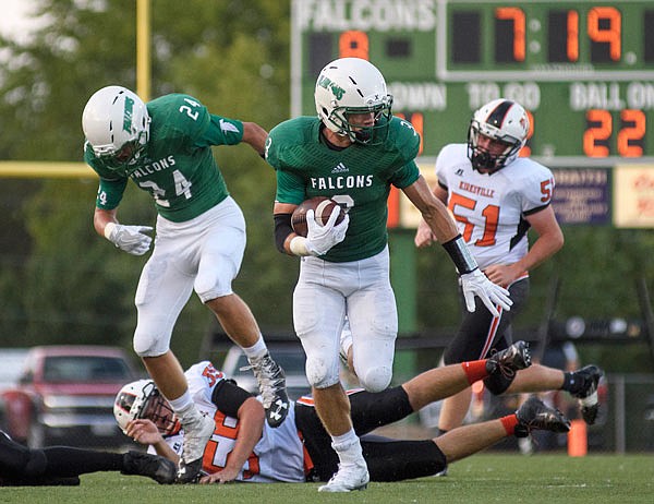 Blair Oaks senior Cody Alexander breaks into the open field and scampers to paydirt for a first-quarter touchdown on a punt return during a game earlier this season against Kirksville at the Falcon Athletic Complex in Wardsville.
