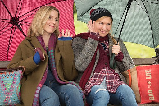 This image released by Universal Pictures shows Sally Phillips, left, and Renee Zellweger in a scene from "Bridget Jones's Baby." 