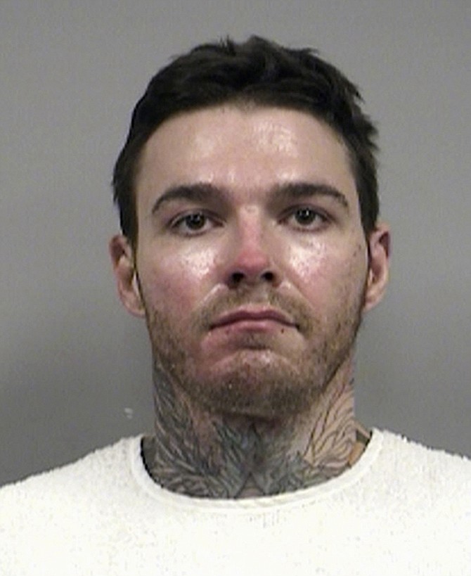 This undated photo provided by the Kansas City, Mo., Police Department shows Kylr Yust. Yust was returned to Kansas City on Wednesday Sept. 14, 2016 from from Benton County to face a charge that he knowingly burned 21-year-old Jessica Runions' vehicle. The woman from the Kansas City suburb of Raymore was last seen leaving a party Thursday night. Police say Yust is also a person of interest in the 2007 disappearance of Kara Kopetsky. 