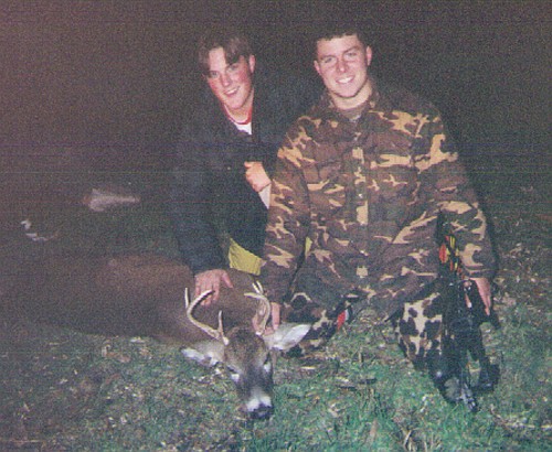 Brandon Butler and his friend Josh Skidmore pose with Brandon's first archery buck taken in 1995.