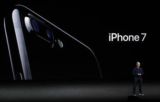 Apple CEO Tim Cook announces the new iPhone 7 during an event to announce new products Wednesday, Sept. 7, 2016, in San Francisco.
