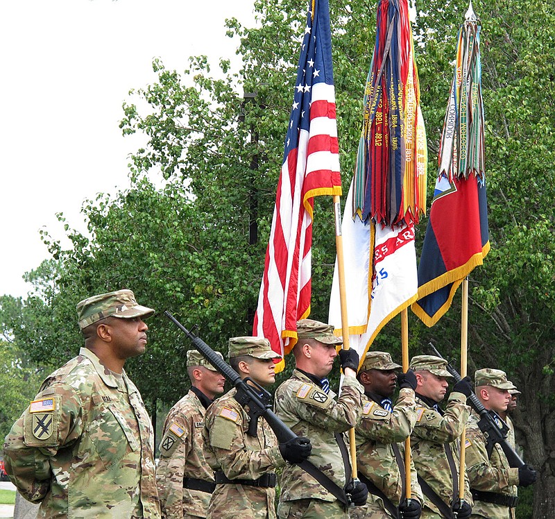 Col. Reginald Neal, far left, commander of the 48th Infantry Brigade of the Georgia National Guard, stands with an Army color guard Friday, Sept. 16, 2016 during a ceremony at Fort Stewart, Ga., to mark the brigade's new alignment with the Army's 3rd Infantry Division. The Army is pairing a dozen National Guard and Reserve units nationwide with active-duty commands, hoping to improve the combat readiness of citizen-soldiers.