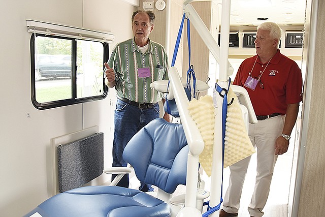 In this September 2016 photo, representatives of Missouri Elks Clubs are in Jefferson City for their annual convention, and they are showing off their new mobile dental unit. Dr. Robert Beck, left, operates this portable dental practice five days a week where he and two dental assistants typically work on about 25 patients a week. At right is Brian Crawford, director of Missouri Elks Benevolent Trust, which provides funding for this and another dental unit in Missouri.