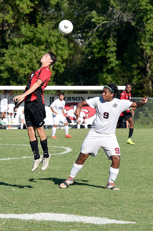Brayden Carron (left) of Jefferson City goes up for a header during Saturday afternoon's game against Poplar Bluff at the 179 Soccer Park.