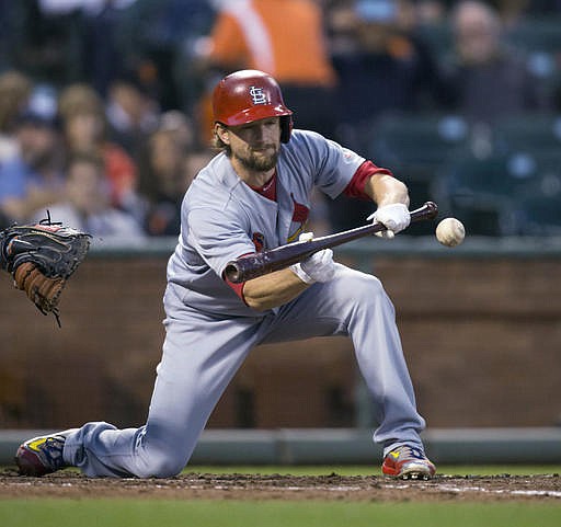 St. Louis Cardinals starting pitcher Mike Leake puts down a sacrifice bunt against the San Francisco Giants during the fifth inning of a baseball game, Saturday, Sept. 17, 2016, in San Francisco. 