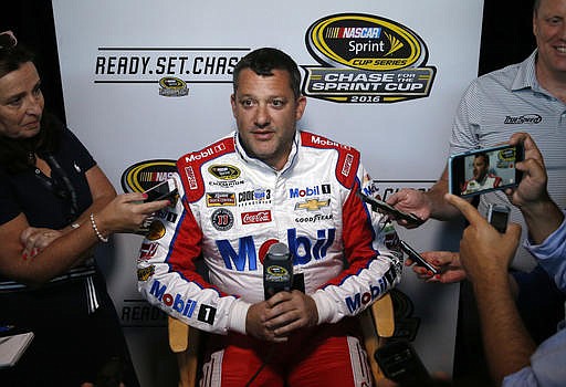 Tony Stewart talks with members of the media during NASCAR Sprint Cup media day in Chicago, Thursday, Sept. 15, 2016. The 16 drivers in the Chase for the Sprint Cup championship took part in the event. The opening race in the Chase is at Chicagoland Speedway on Sunday in Joliet, Ill. 