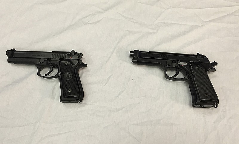 A semi-automatic handgun, left, is displayed next to a Powerline 340 BB gun, right, similar to a BB gun authorities said a teenager carried when he was shot and wounded by a Baltimore police officer, displayed during a news conference in Baltimore.