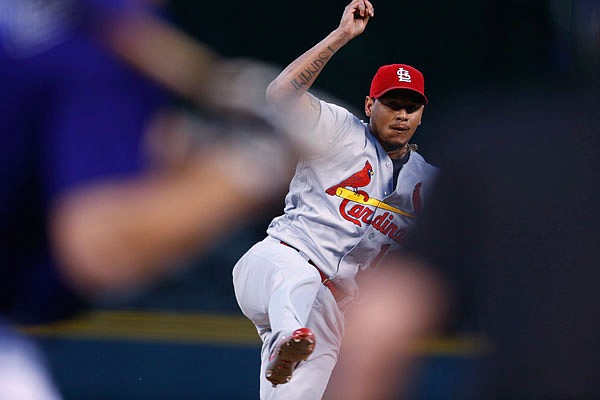 Cardinals starting pitcher Carlos Martinez delivers a pitch during Monday night's game against the Rockies in Denver.