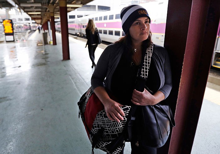 Erin Murphy, 49, of Marshfield, Mass., stands during a Monday interview regarding fears of terrorism while waiting for her train at the South Station in Boston.