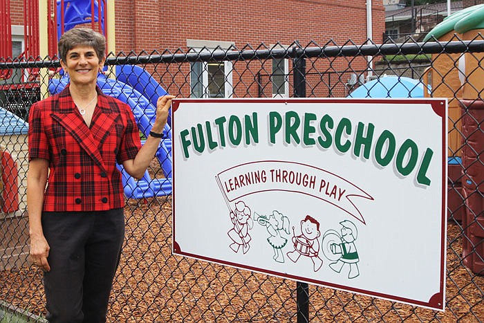 Retired Fulton Preschool Association teacher Sue Beaty poses outside the school where she taught for 25 years.