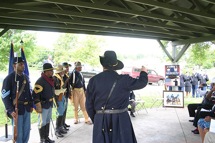 Lincoln University art professor Essex Garner, far left, participates in a commemoration of the 150th anniversary of the formation of the U.S. Army 10th Cavalry Regiment, commonly known as the Buffalo Soldiers.