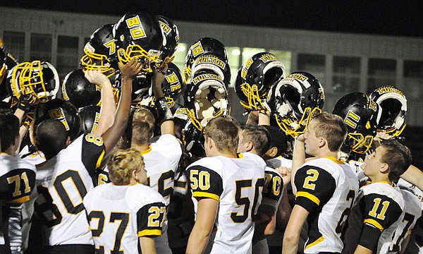 The Fulton Hornets celebrate after their 26-14 North Central Missouri Conference victory last Friday night at Marshall. The Hornets have a 3-2 record and are 1-1 in the NCMC as they host the Hannibal Pirates tonight at Robert E. Fisher Jr. Stadium.