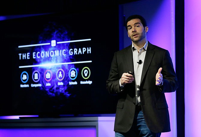 LinkedIn CEO Jeff Weiner speaks during a product announcement at his company's headquarters Thursday in San Francisco. LinkedIn wants to become more useful to workers by adding personalized news feeds, helpful messaging "bots" and recommendations for online training courses, as the professional networking service strives to be more than just a tool for job-hunting. 