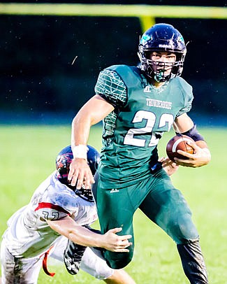 North Callaway running back Wyatt Branson tries to slip away from a Clopton/Elsberry defender during the Thunderbirds' 20-6 Eastern Missouri Conference win against the IndianHawks last Friday night in Kingdom City.