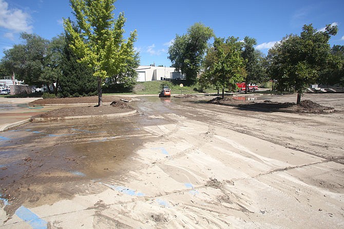 Mud from floodwater fills the parking lot of the Washington Park Ice Arena Sept. 9. Significant flooding in the area has occurred twice in the past few months. The heavy rains have brought the topic of how to deal with stormwater problems in Jefferson City back to the surface.
