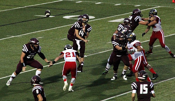 School of the Osage quarterback Zach Wheeler fires a pass in the direction of wideout Jason Edwards (8) during last Friday's game against Southern Boone.