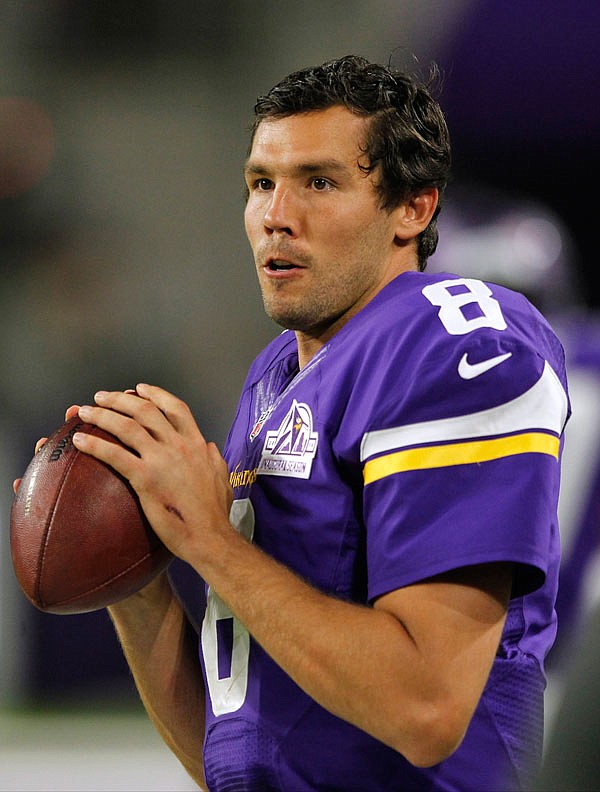 Vikings quarterback Sam Bradford warms up on the sidelines during the second half of Sunday's game against the Packers in Minneapolis.