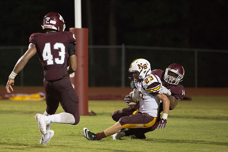 Atlanta defender Reggie Blaylock tackles New Boston kicker Jacob Bobbitt in the end zone for a safety in the second quarter of a football game Friday at Rabbit Stadium. Atlanta beat the Lions 52-0.