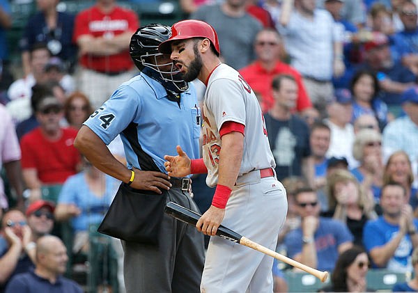 Cardinals' Matt Carpenter argues a called third strike with home plate umpire CB Bucknor during the ninth inning of Friday's game against the Cubs in Chicago. 