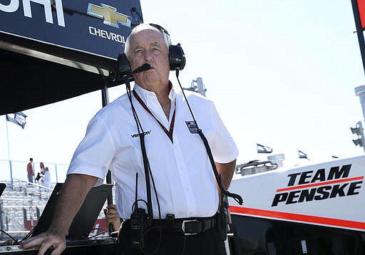  In this Sept. 3, 2016, file photo, Roger Penske watches from the pits during practice for the IndyCar Grand Prix at The Glen auto race, in Watkins Glen, N.Y. It was the year of Roger Penske in IndyCar, as no team came close to stopping Team Penske's march to the top of the standings.