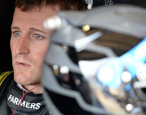  In this March 19, 2016, file photo, Kasey Kahne sits in his race car prior to the final practice session for the NASCAR auto race at Auto Club Speedway in Fontana, Calif. 