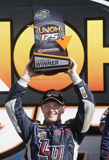 William Byron celebrates after winning the NASCAR Camping World Truck Series UNOH 175 auto race at New Hampshire Motor Speedway, Saturday, Sept. 24, 2016, in Loudon, N.H 