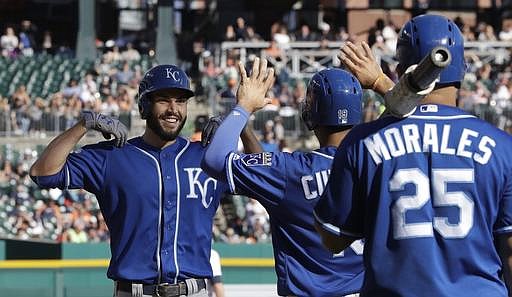Kansas City Royals' Eric Hosmer, left, is greeted at home after his three-run home run in the ninth inning of a baseball game against the Detroit Tigers, Saturday, Sept. 24, 2016, in Detroit.