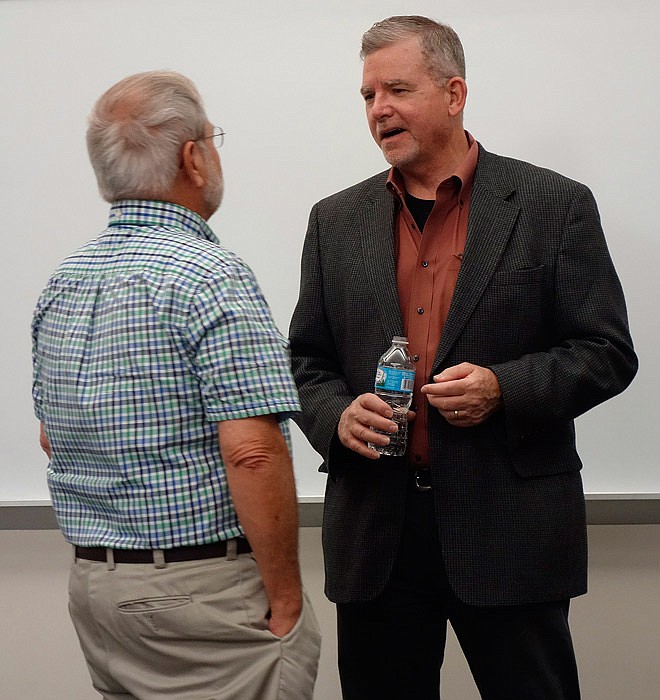Former Secret Service Agent Tim Wood, right, talks with Fulton resident Denton Kurtz on Friday, Sept. 23, 2016 at Westminster College. Wood was talking about his memoir and recounting wild and woolly tales of his 22 years serving in that agency.