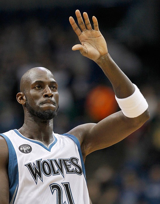 In this Dec. 26, 2015, file photo, Timberwolves forward Kevin Garnett waves during a game against the Pacers in Minneapolis. Garnett has informed the Timberwolves he will retire after 21 seasons.