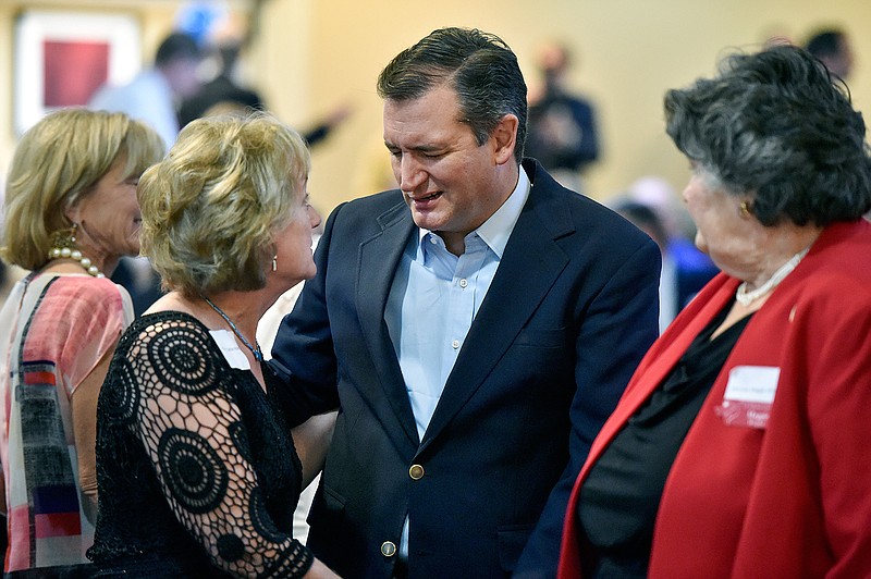 Sen. Ted Cruz, R-Texas, center, talks with Cathie Adams, past president of Texas Eagle Forum, at the annual Grassroots America We The People Champions of Freedom award dinner Friday, Sept. 23, 2016 in Tyler, Texas. Ted Cruz announced Friday he will vote for Donald Trump, a dramatic about-face that may help unite a deeply divided Republican Party months after the fiery Texas conservative called Trump a "pathological liar" and "utterly amoral." 