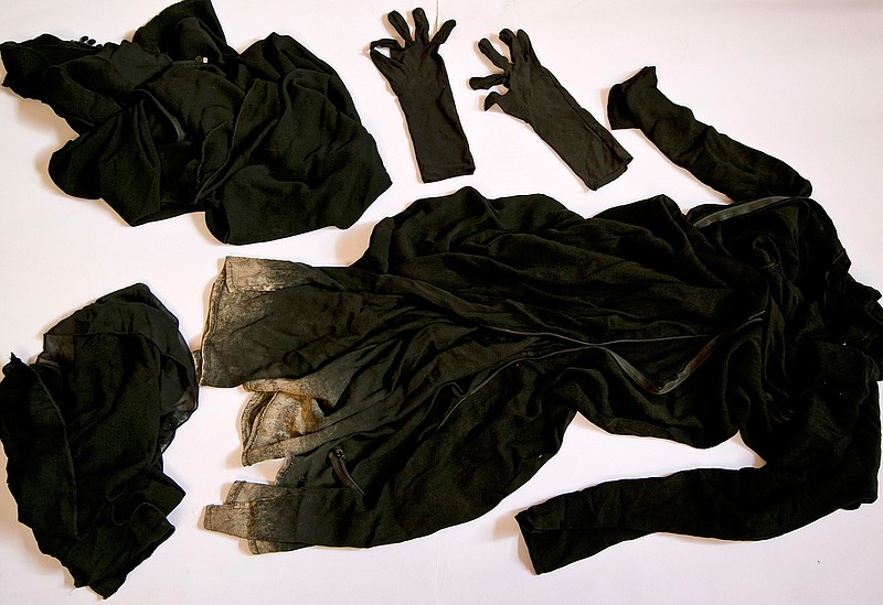 Clothing worn by a Yazidi girl enslaved by Islamic State militants, collected by a Yazidi activist to document Islamic State group crimes against the community, shown in this file photo taken May 22, 2016, in Dohuk, northern Iraq. Lawyers in Europe investigating the Islamic State's elaborate operation to kidnap thousands of women as sex slaves say they have enough evidence to try IS leaders with crimes against humanity, but two years after the IS onslaught against the Yazidi people, the Obama administration has made little effort to pursue prosecution. Current and former U.S. State Department officials say that a push for a legal finding of genocide in late 2014 was quashed by the Defense Department.