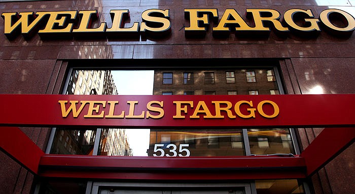 A Wells Fargo sign is displayed at a branch in New York. Wells Fargo has been in the spotlight after its employees allegedly created up to 2 million bank and credit card accounts, transferred customers' money without telling them and even created fake email addresses to sign people up for online banking in an effort to meet lofty sales goals. 