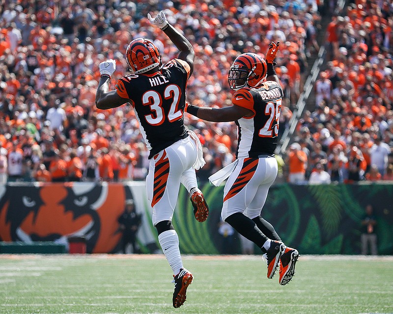 Cincinnati Bengals running back Jeremy Hill (32) celebrates with running back Giovani Bernard (25) after scoring a touchdown  during the first half of an NFL football game against the Denver Broncos, Sunday, Sept. 25, 2016, in Cincinnati. 