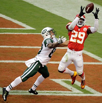 Chiefs defensive back Eric Berry intercepts a pass intended for Jets wide receiver Jalin Marshall during the second half of Sunday afternoon's game at Arrowhead Stadium.