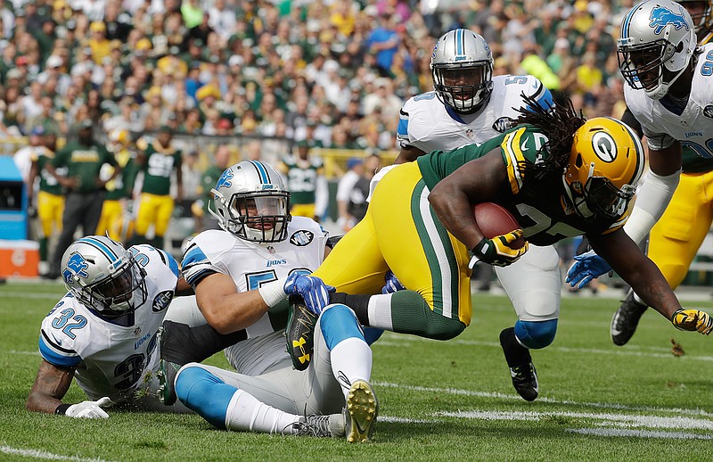 Detroit Lions' Kyle Van Noy tackles Green Bay Packers' Eddie Lacy during the first half of an NFL football game Sunday, Sept. 25, 2016, in Green Bay, Wis. 