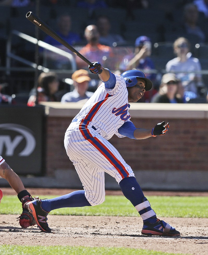 New York Mets' Curtis Granderson looks after a solo home run during the fourth inning of the baseball game against the Philadelphia Phillies at Citi Field, Sunday, Sept. 25, 2016 in New York. 