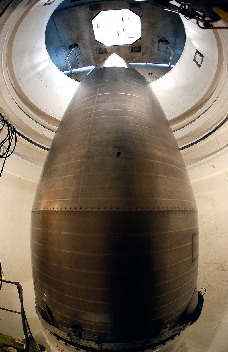 In this June 25, 2014 file photo, the warhead-containing nose cone of an inert Minuteman 3 missile is seen in a training launch tube at Minot Air Force Base, N.D. As defense chief for a president who famously envisioned "a world without nuclear weapons," Ash Carter has said remarkably little about them. He has been quiet on a range of nuclear issues, including the Pentagon's efforts to correct an array of morale, training, discipline and resource problems in the Air Force nuclear missile corps. This is all the more notable for the fact that Carter, a physicist by training and policy wonk by reputation, cut his professional teeth on nuclear weapons during the Cold War. This quiet approach is expected to end when Carter visits Minot Air Force Base in North Dakota on Monday, Sept. 26, 2016. 